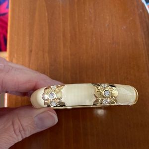 Cream colored bracelet with clear stone accents